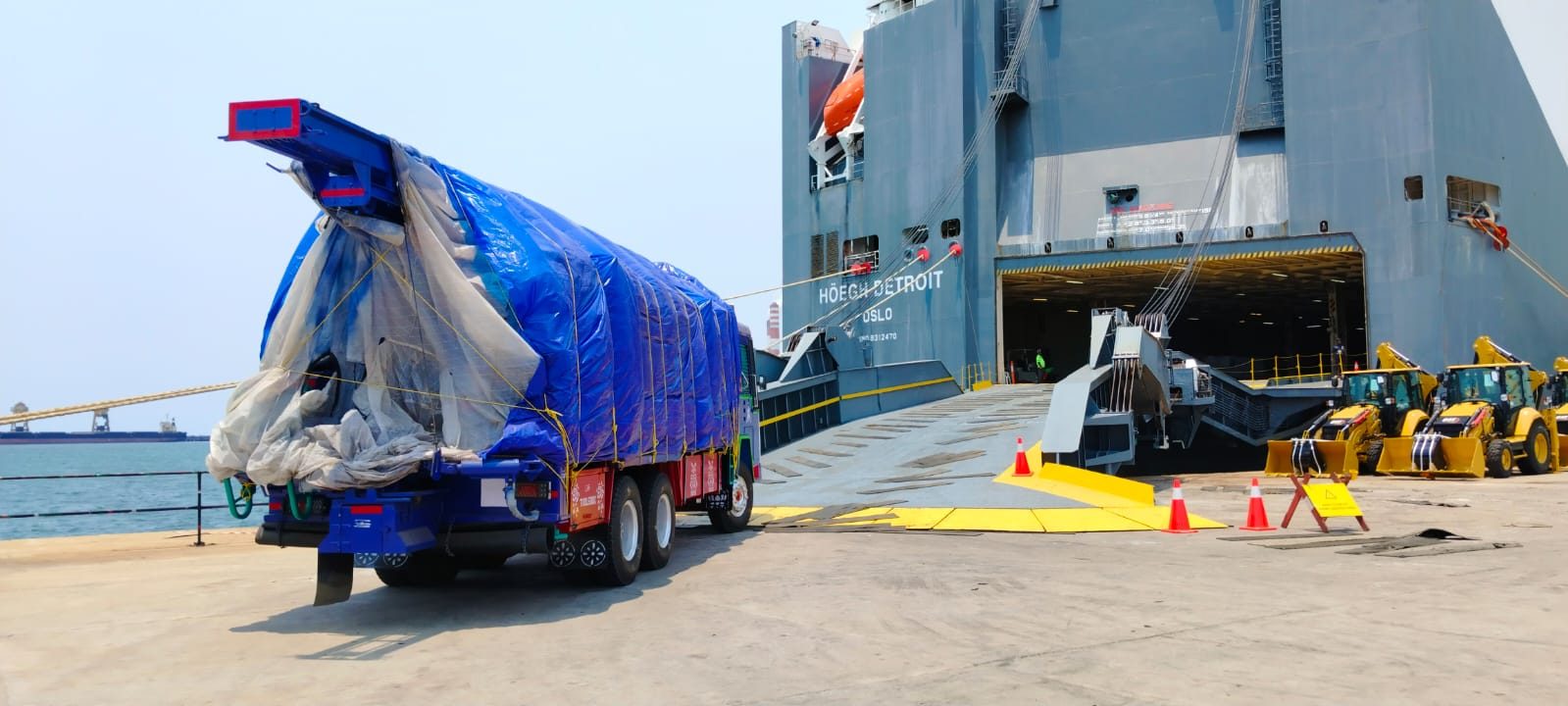 An Apex-built drilling rig on the quayside, sheeted and ready to board a roll-on/roll-off vessel for its buyer